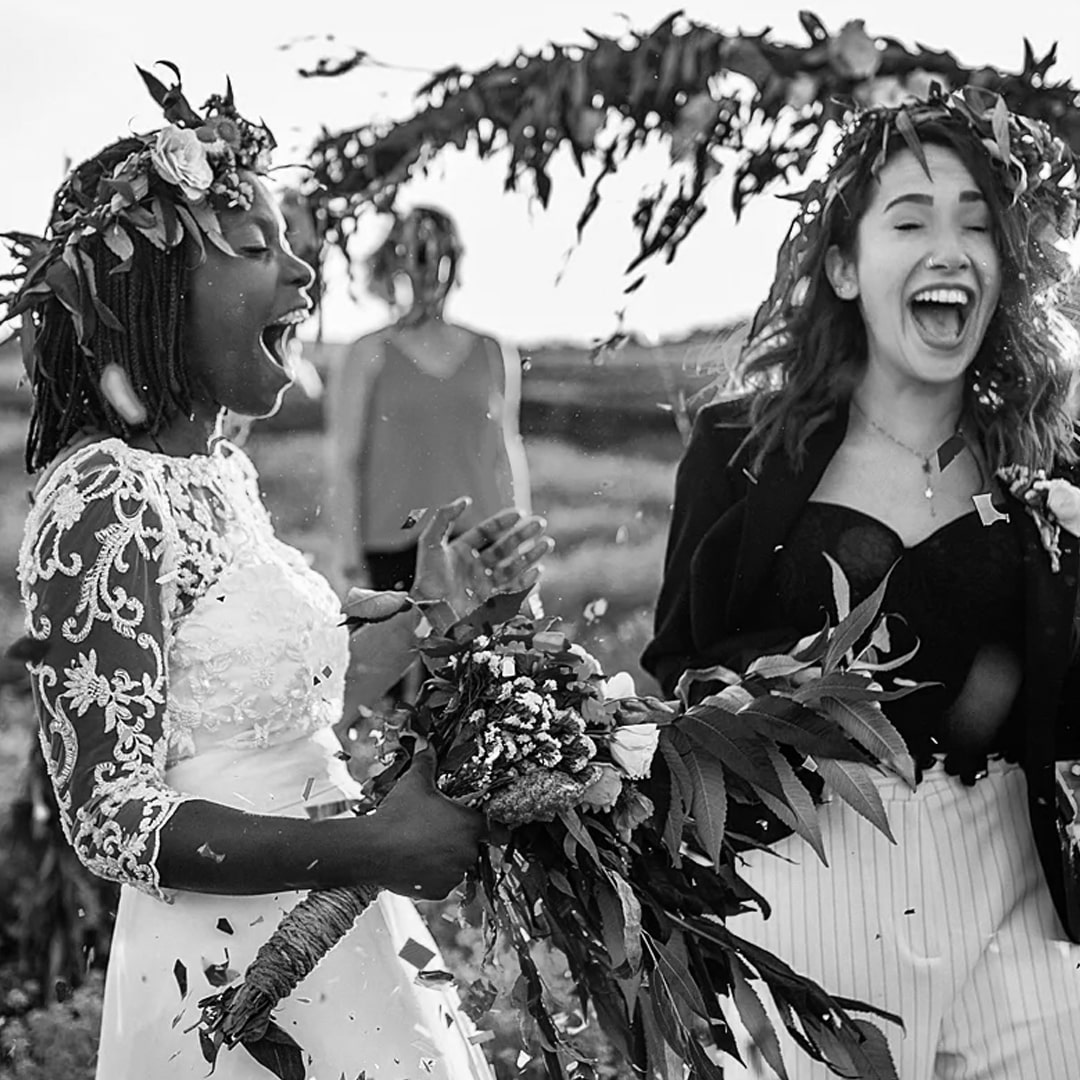 Two Women Smiling With Wedding Bands