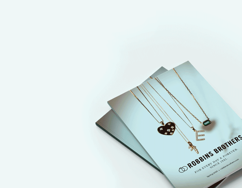 Spring jewelry collection showcasing brilliant diamond engagement rings, wedding bands, and fine jewelry against a soft, romantic background for Mother’s Day gifting